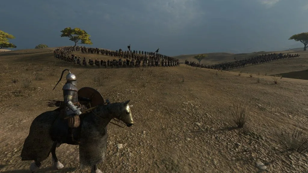 Mount & Blade 2 Bannerlord screenshot of  a knight in front of a large army among the hills.