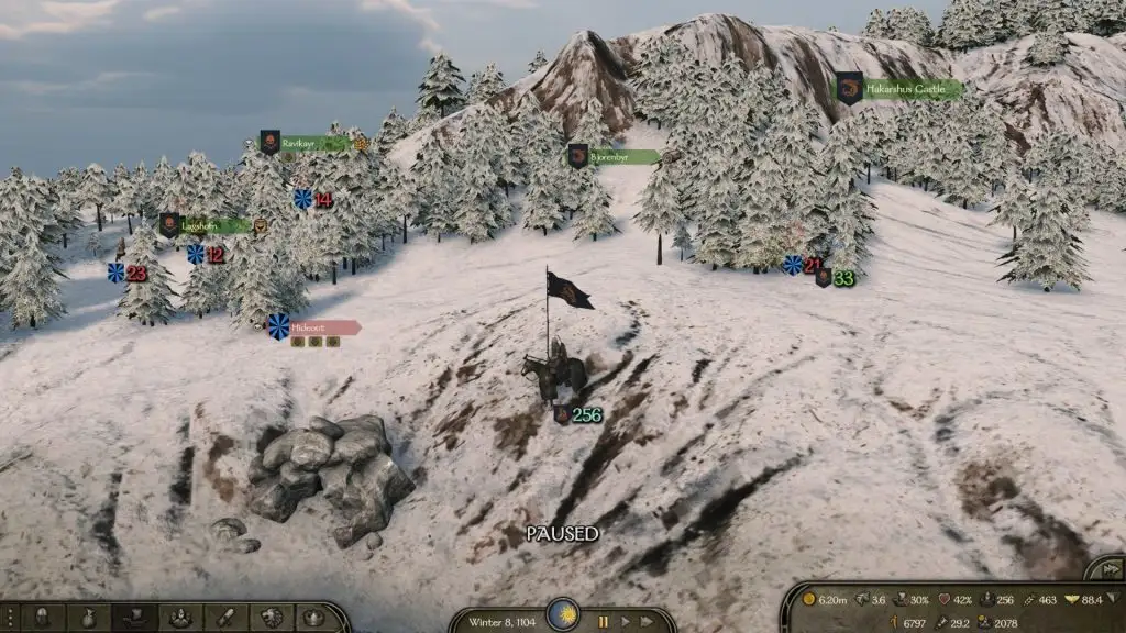 Mount & Blade 2 Bannerlord screenshot of the overworld map near a hideout. The area is covered in snow an trees are visible in the distance.